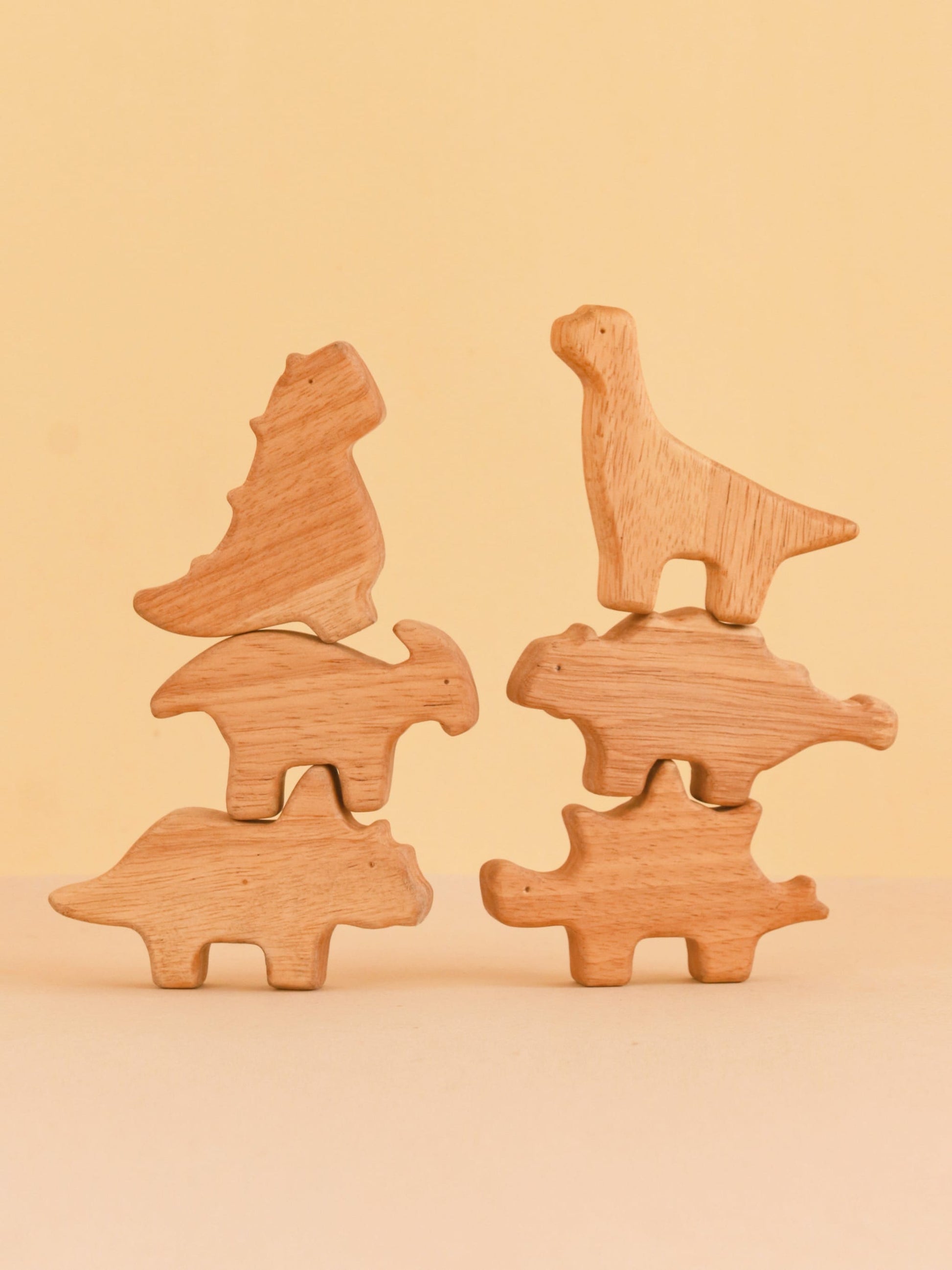 Dino Stack Mini wooden dinosaur figurines in eco-friendly cardboard box packaging