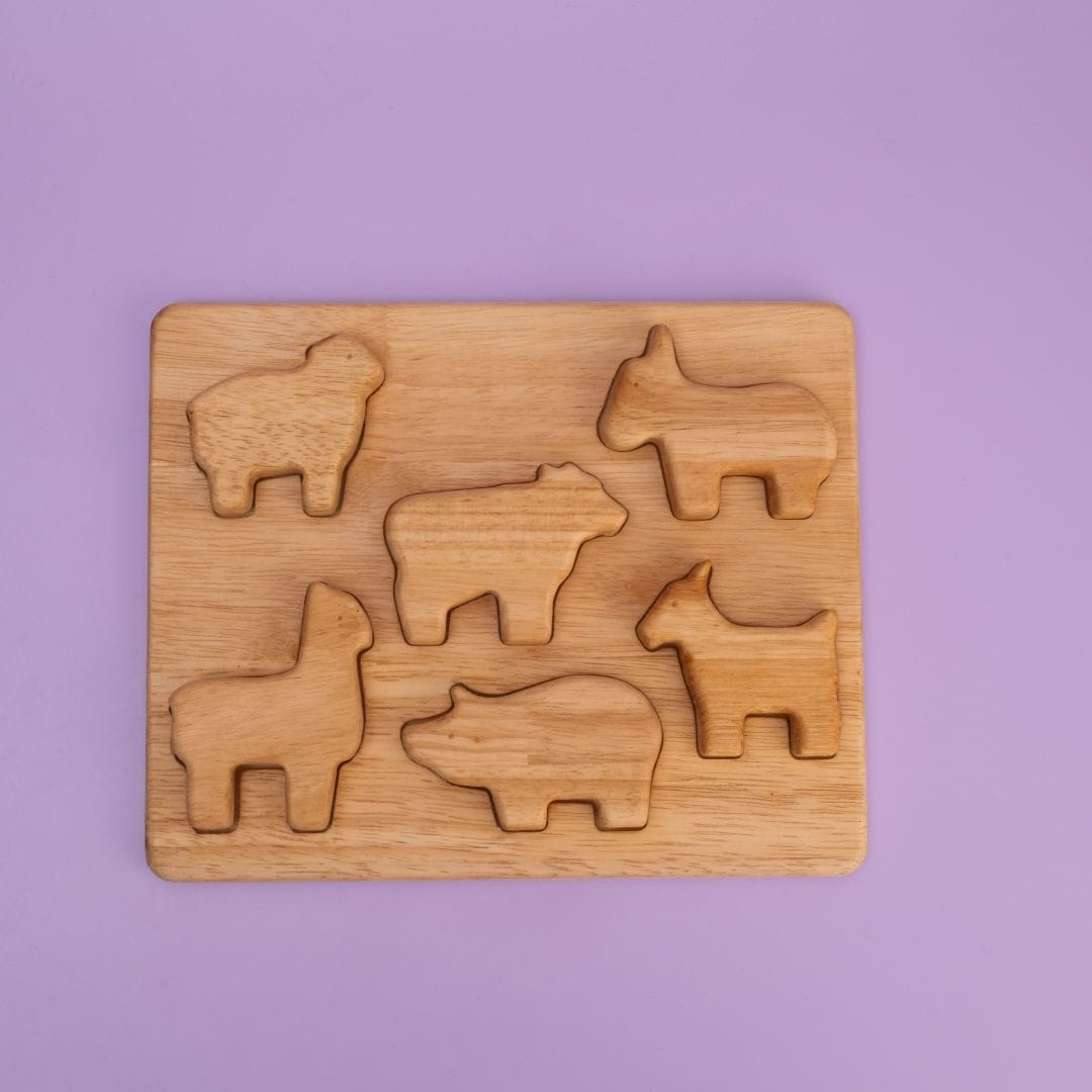 Farm Animal Stack Mini Plus wooden puzzle board with 7 farm animal shaped pieces in tray