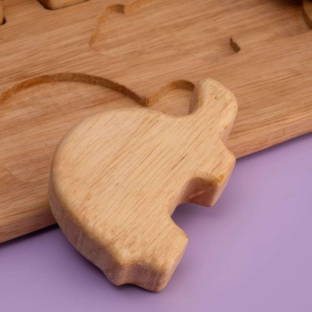 Wild Animal Stack Mini Plus wooden animal figurines stacked in a tower showing balancing play