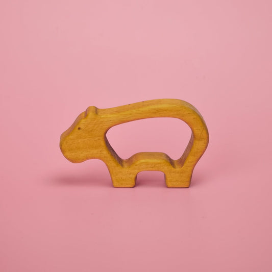 Wooden baby animal teether shaped like a hippo with grip-through hollow center for little hands