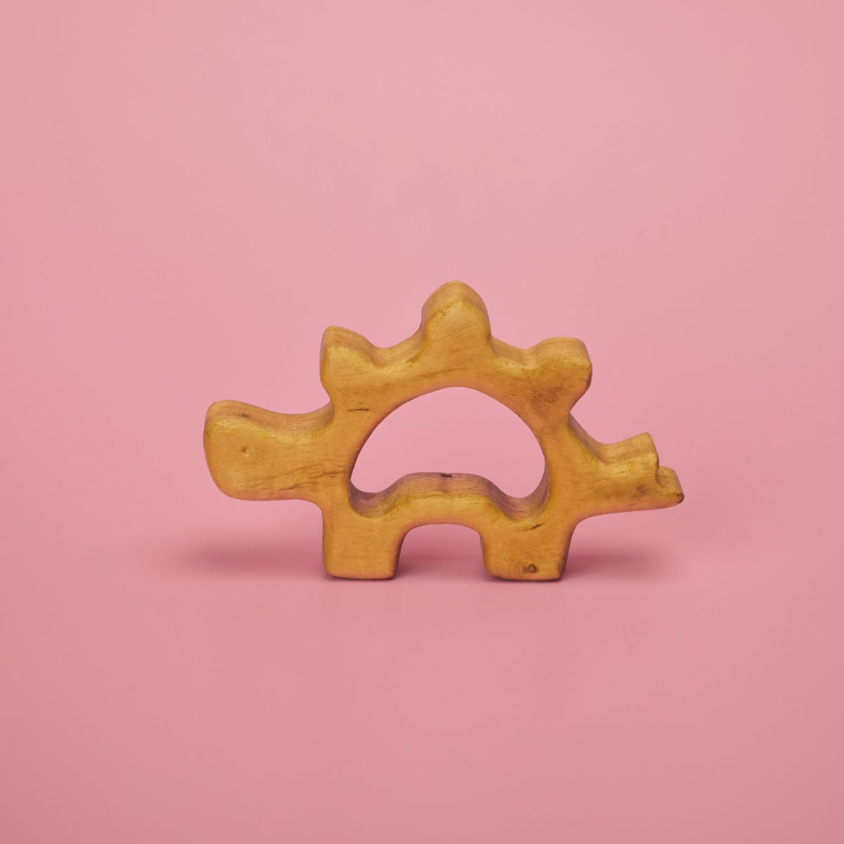 Wooden baby dinosaur teether shaped like a parasaurolophus with chunky tactile design for babies