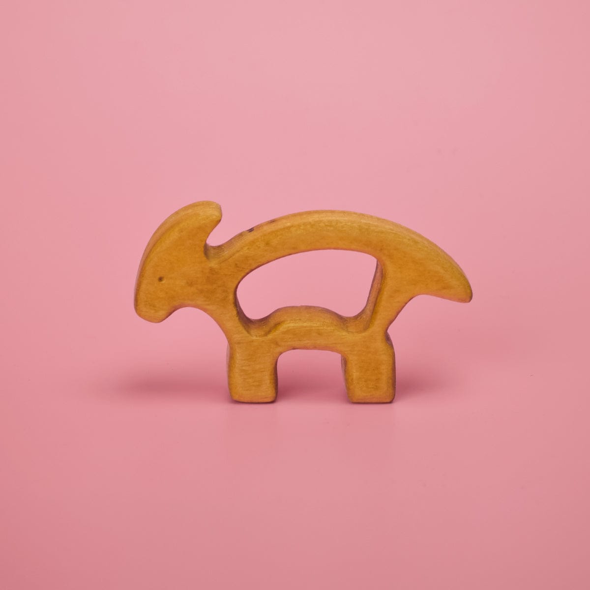 Wooden baby dinosaur teether shaped like a T-rex with smooth rounded edges for safe teething